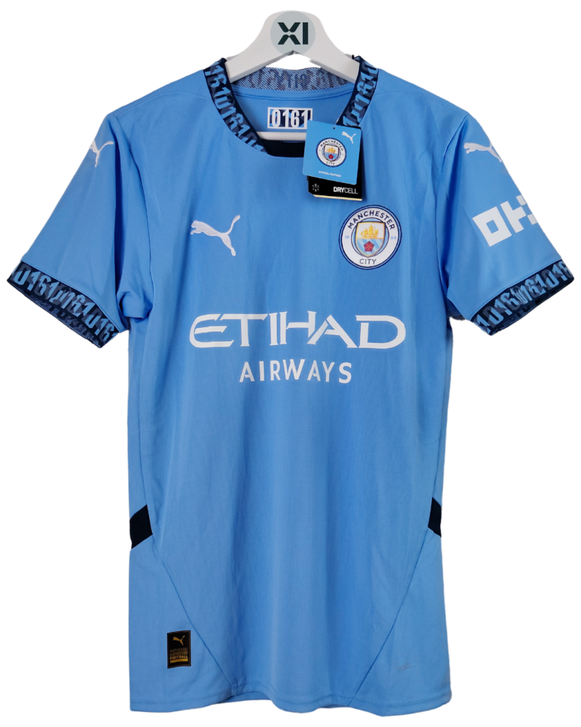 Manchester City blue football jersey on hanger with Etihad Airways sponsor and club crest on chest